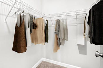 Clothes hanging on a clothesline in a room.